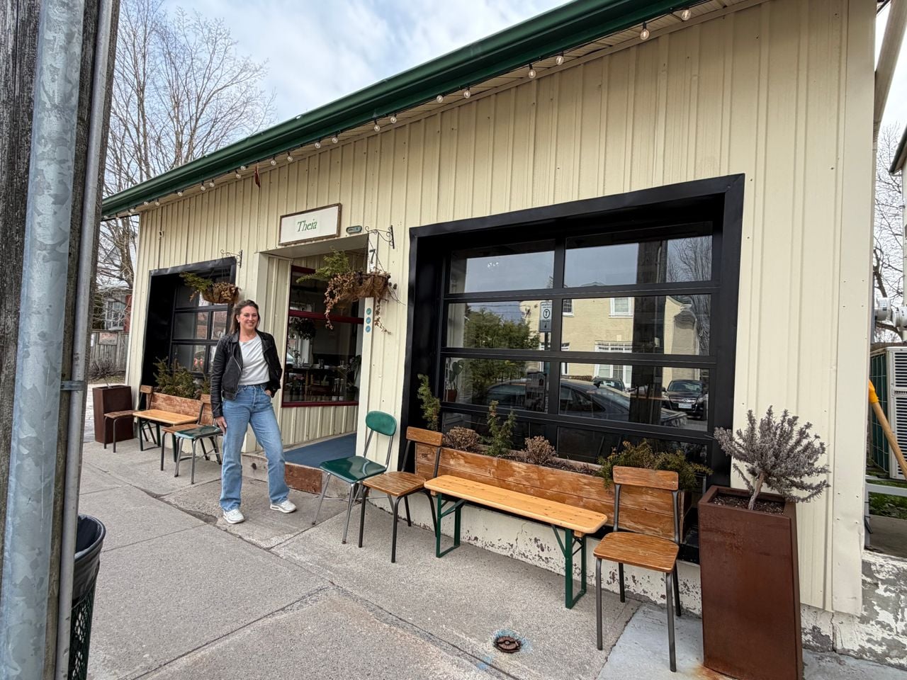 Amanda Ray stands outside of Theia