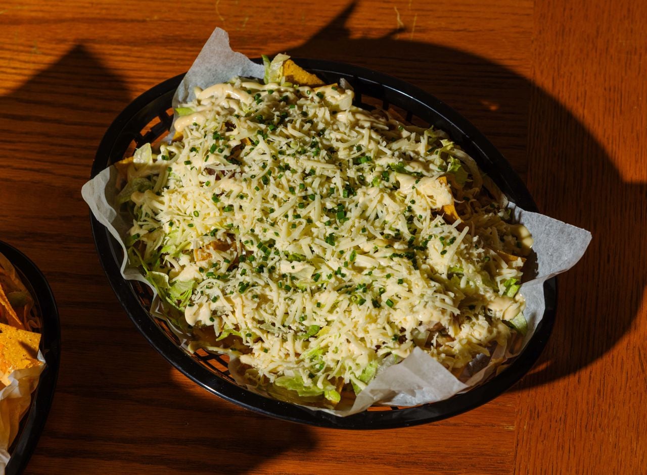 A basket of cheese-covered nachos