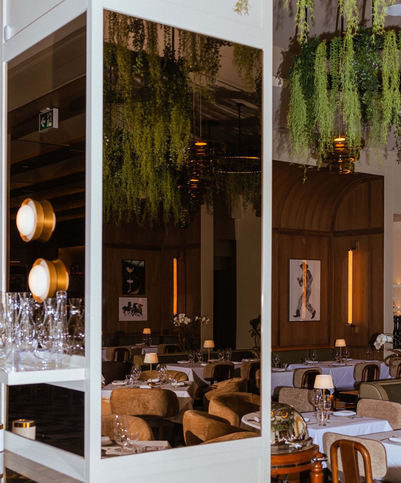 A mirror reflects the dining room inside Riley's Fish and Steak