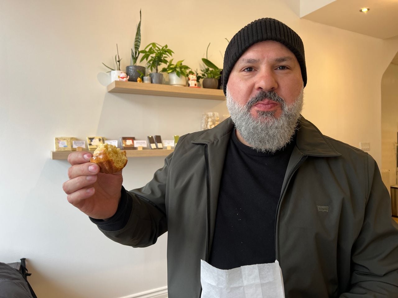 Chef Moeen Abuzaid holds a lemon madeleine