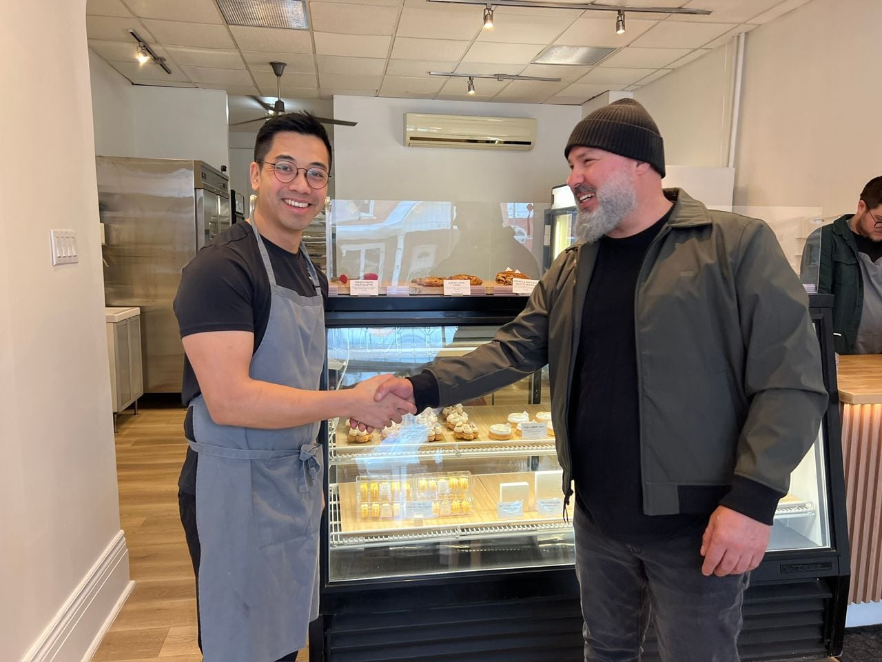 Chocolatier Steven Tran and chef Moeen Abuzaid shake hands