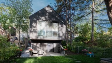 Inside a sloped two-storey Danforth garden suite with cathedral ceilings