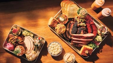 Pitmaster Andrew Golden breaks down a platter from Golden Horseshoe Barbecue