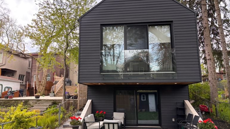 Inside a sloped two-storey Danforth garden suite with cathedral ceilings