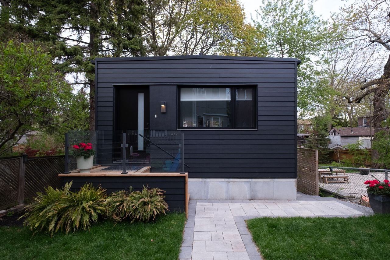 Inside a sloped two-storey Danforth garden suite with cathedral ceilings
