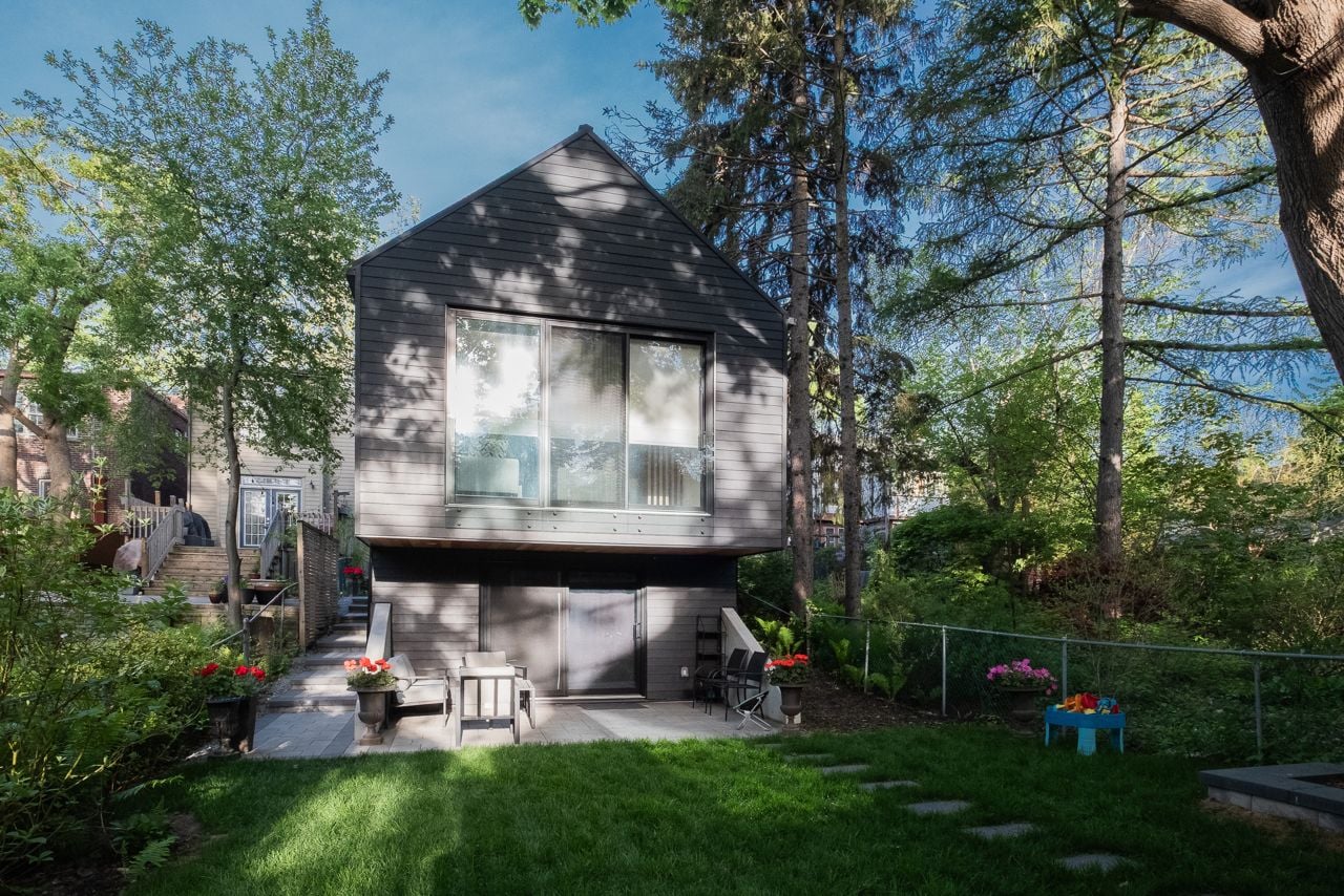 Inside a sloped two-storey Danforth garden suite with cathedral ceilings
