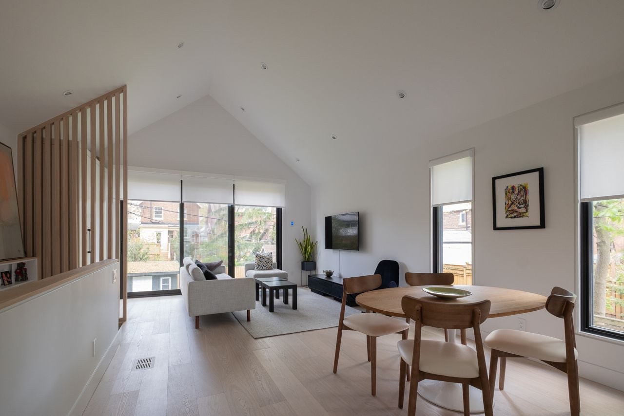 Inside a sloped two-storey Danforth garden suite with cathedral ceilings