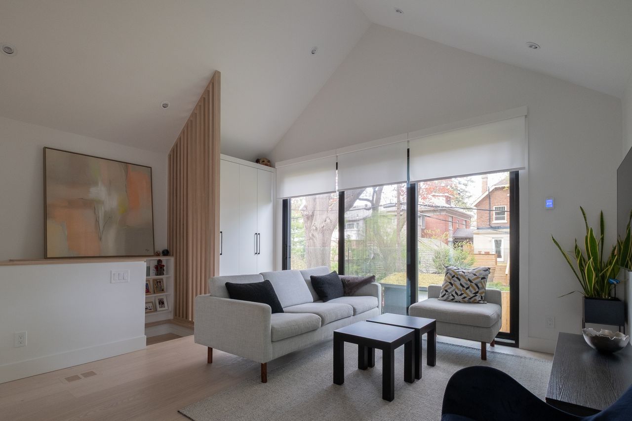 Inside a sloped two-storey Danforth garden suite with cathedral ceilings