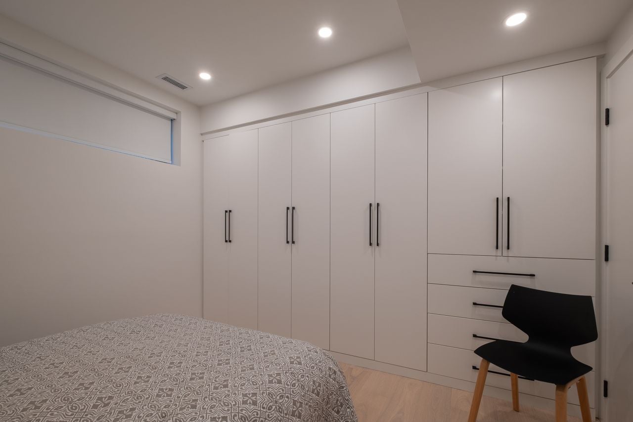 Inside a sloped two-storey Danforth garden suite with cathedral ceilings