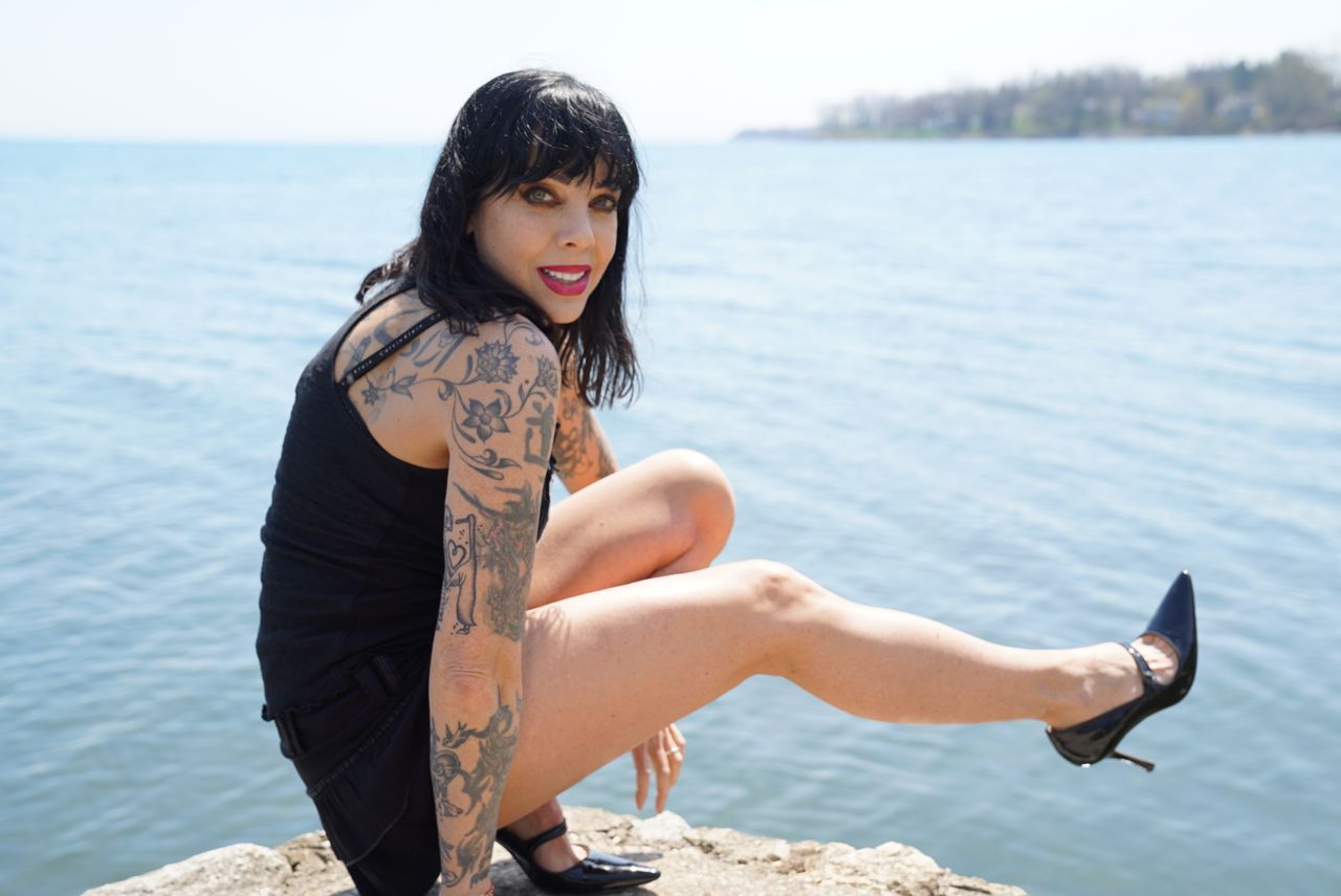 Dark haired musician with tattoos