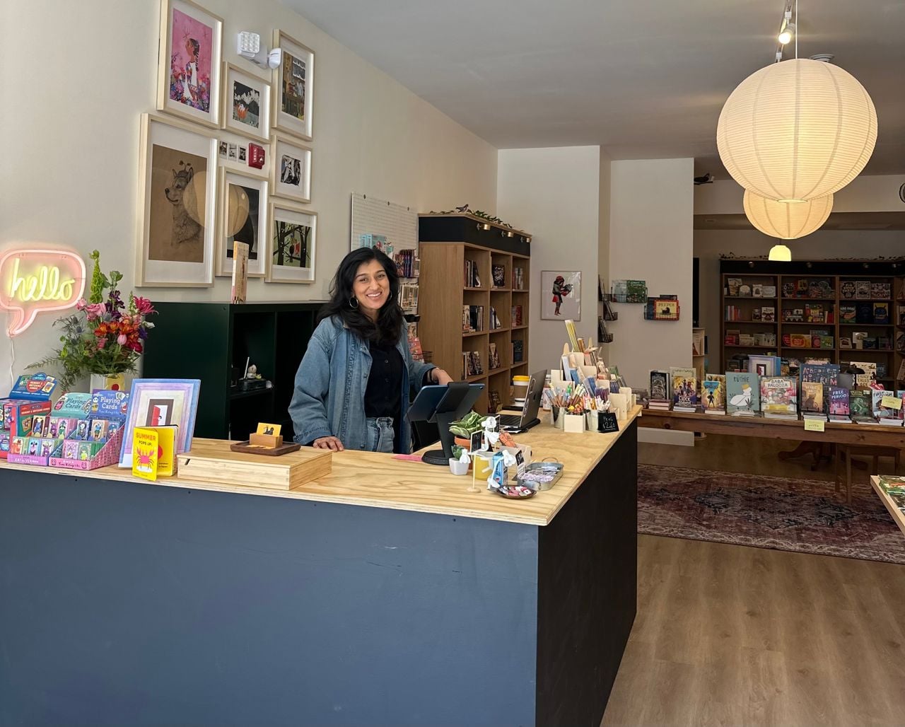 Woman behind the counter of a bookstore