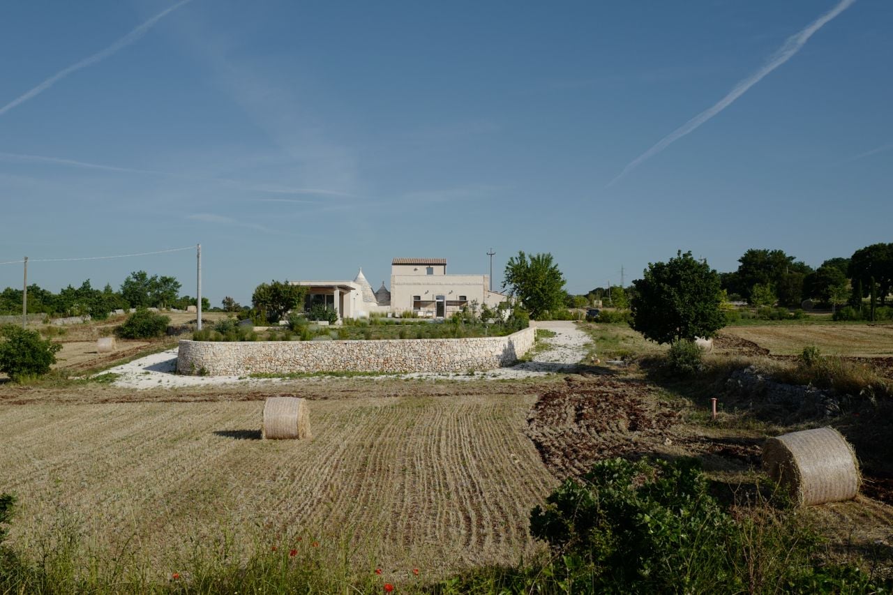 The farmhouse from across a garden and field