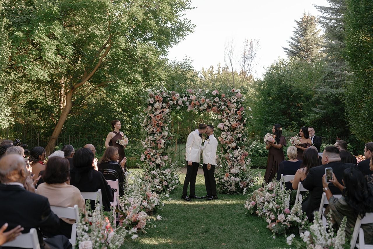 Two grooms saying vows