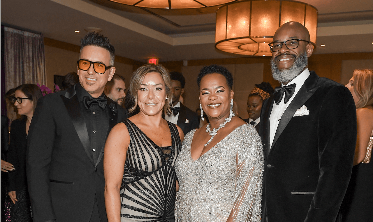 Four stylish people in sparkly formal wear