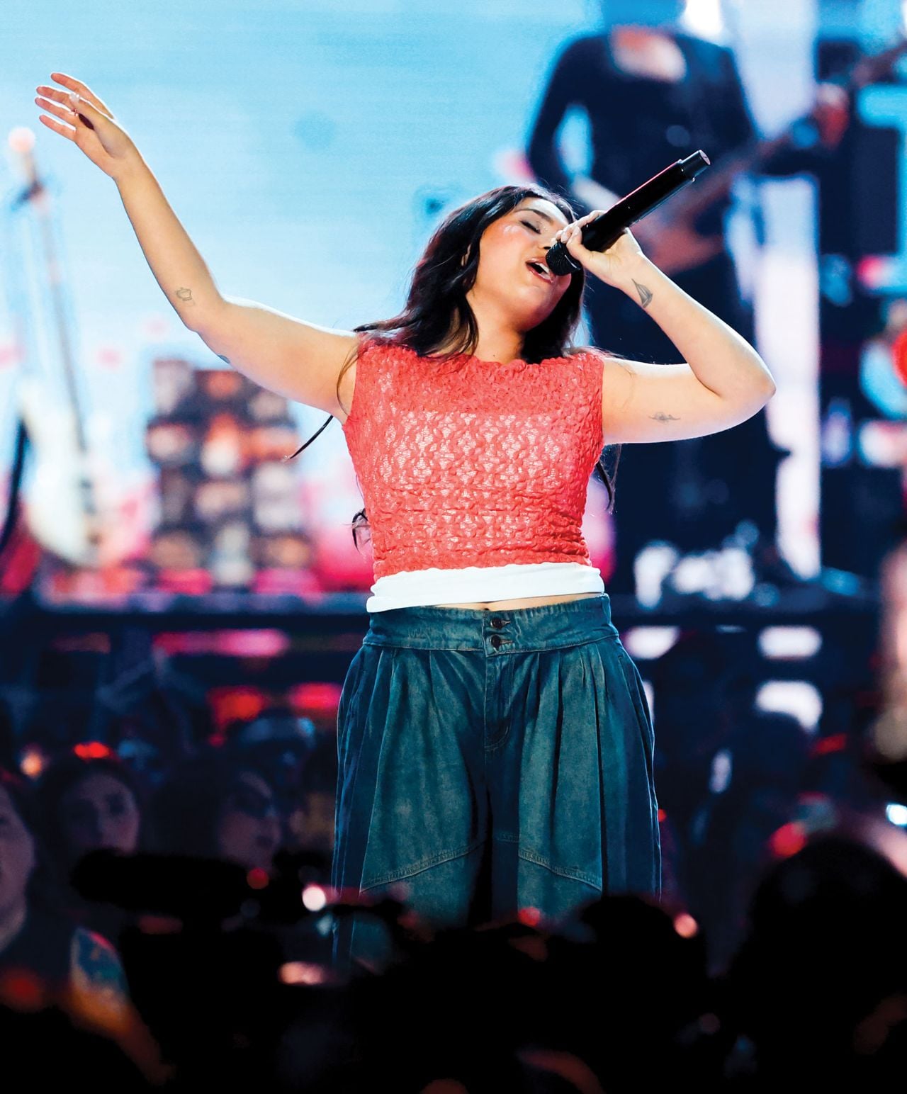 Singer Alessia Cara performing onstage