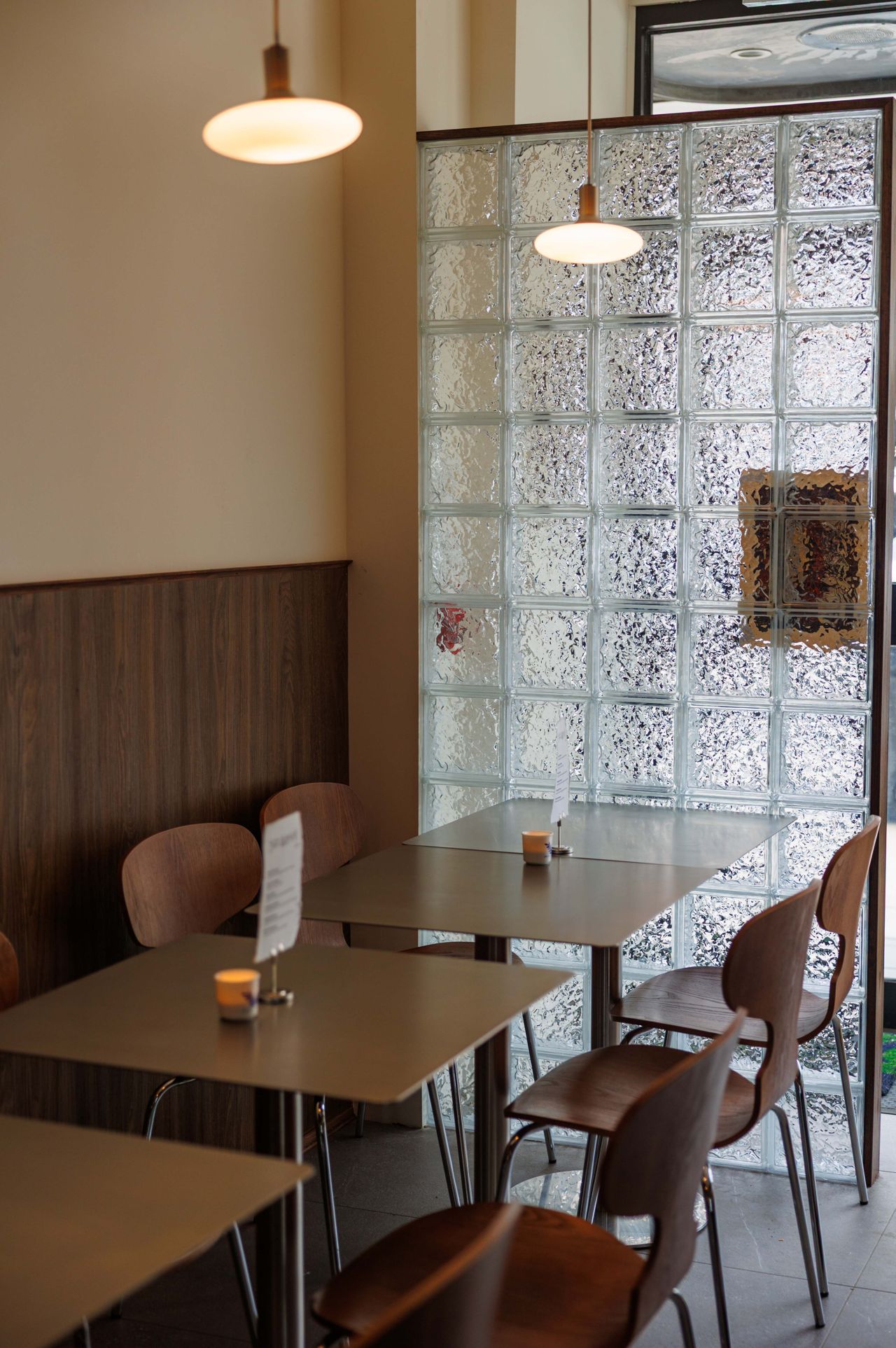 Tables inside Chez Wa, a new wine bar in Toronto