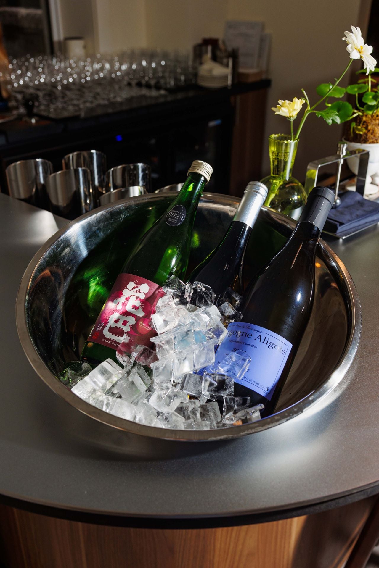 Bottles of wine in a bowl filled with ice
