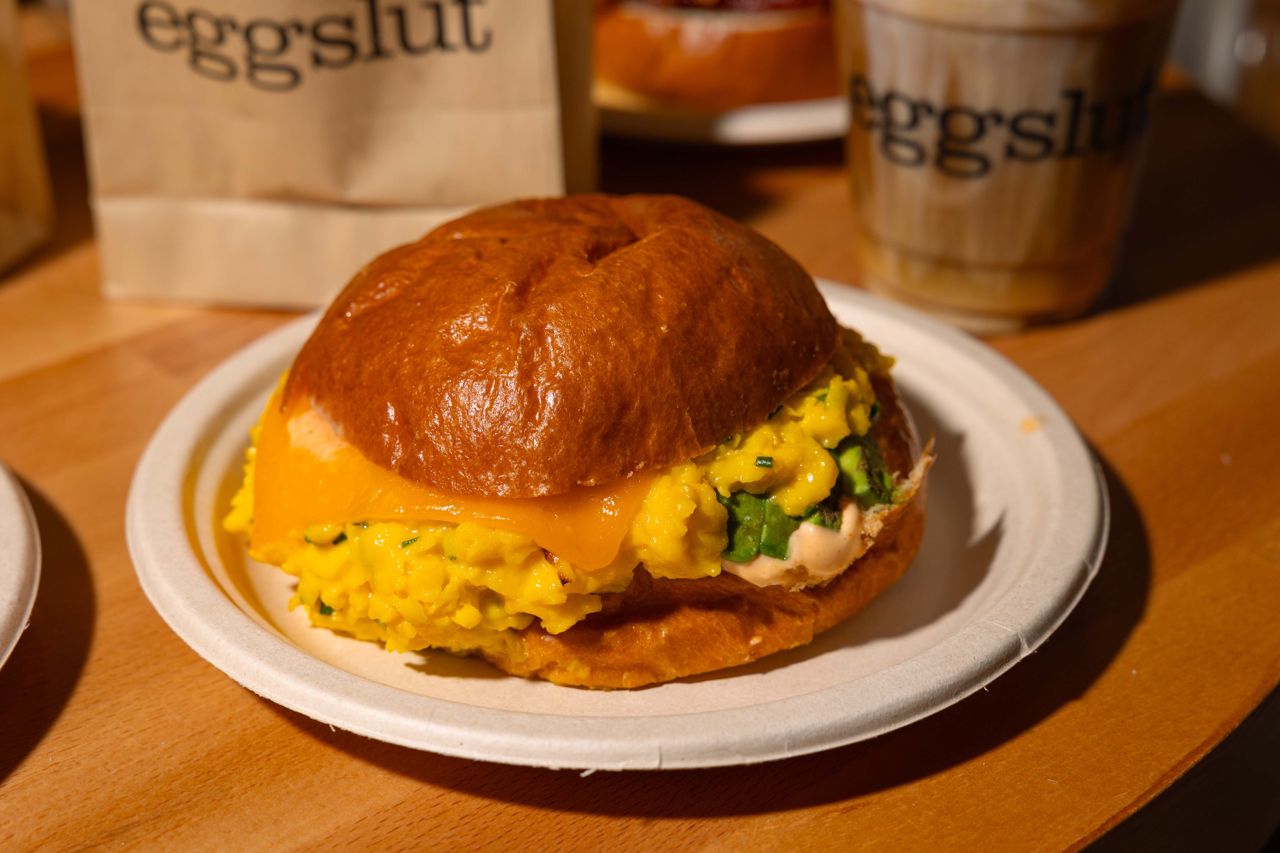The Fairfax piles soft, chive-flecked scrambled eggs, caramelized onions, Sriracha mayo and cheddar cheese onto a warm brioche bun