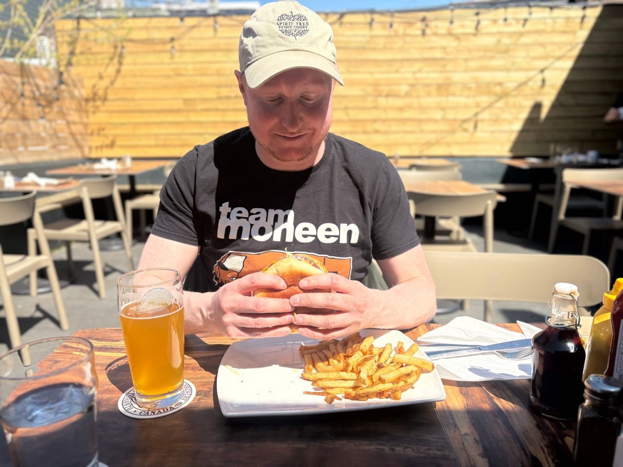Chef Adam Ryan picks up a burger