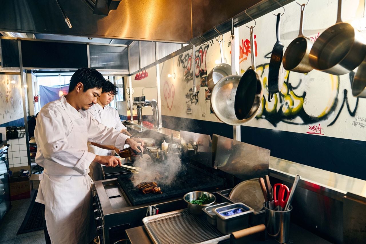 Chefs work in the kitchen of Gyopo Brewery