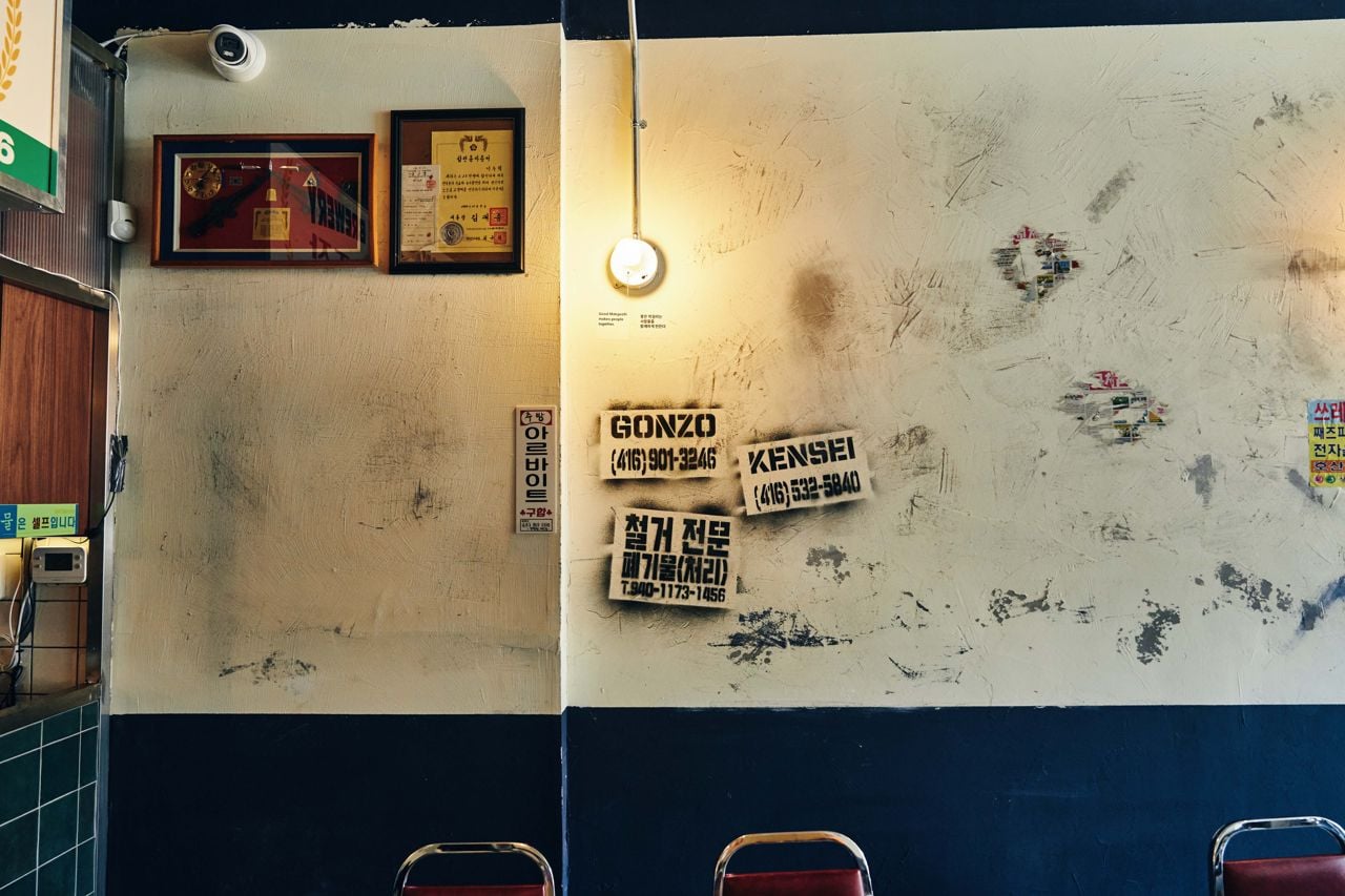 Walls in the dining room of Gyopo Brewery are decorated with graffiti