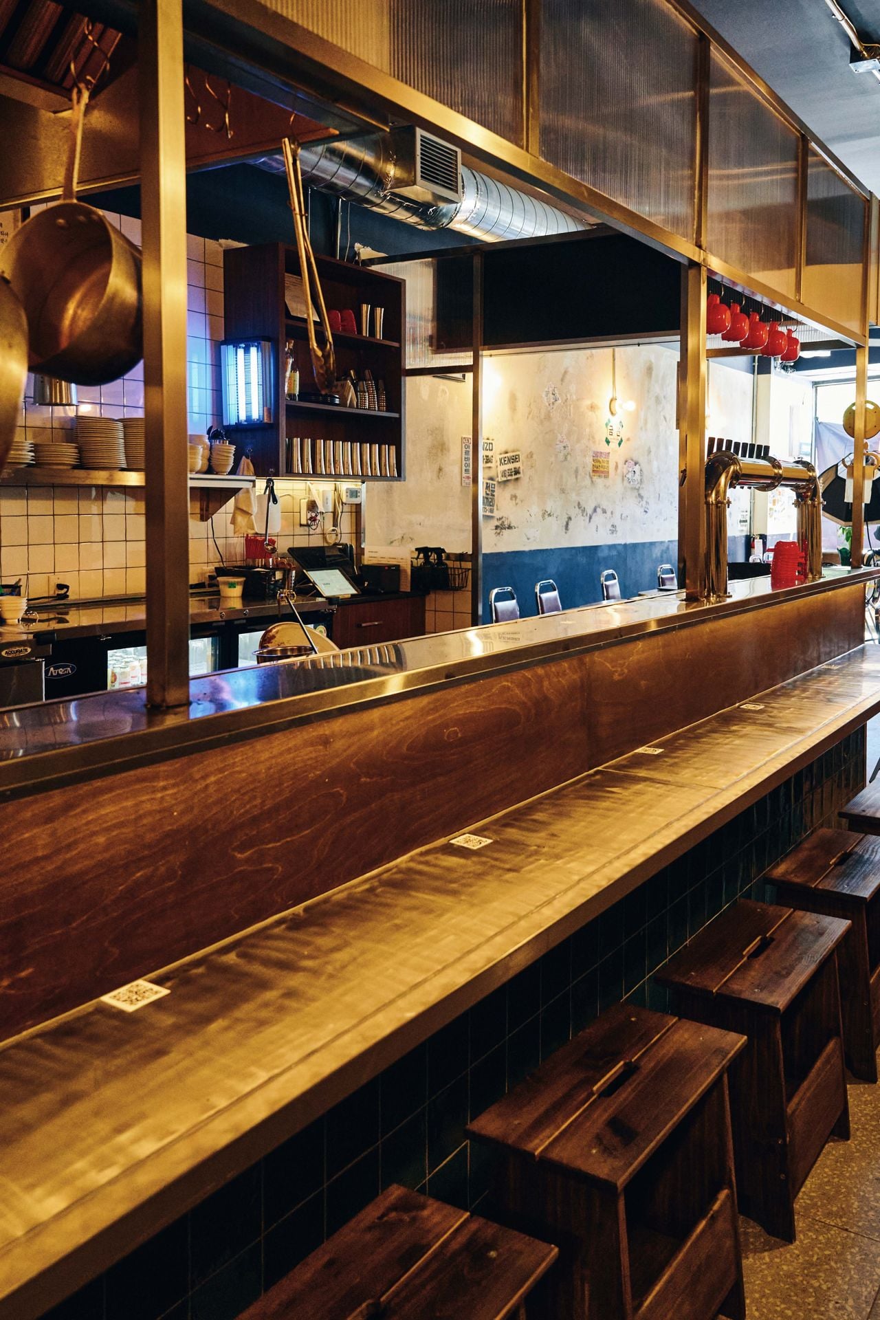 Counter seating by the open kitchen at Gyopo Brewery