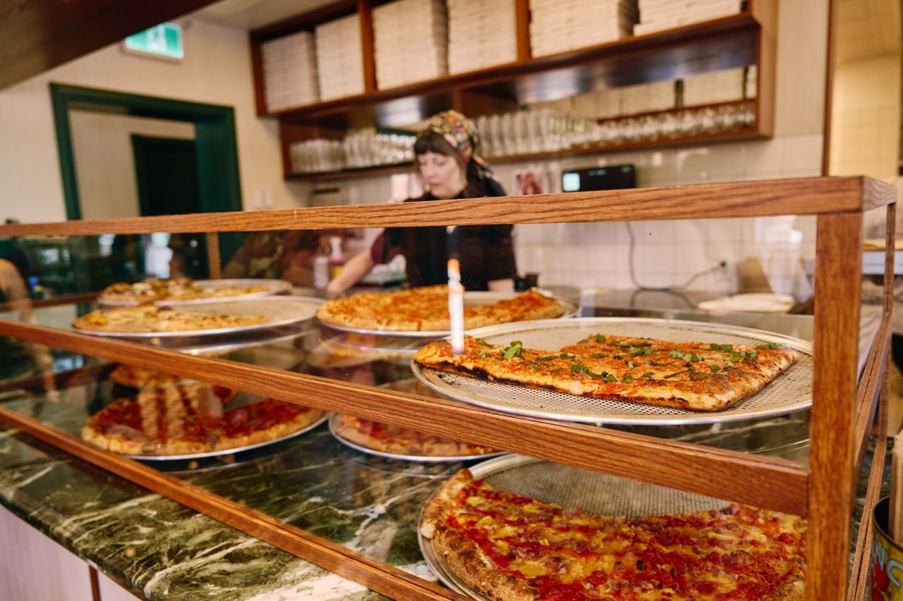 Pizza slices in a display case