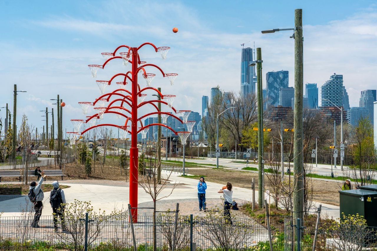 Sculpture shaped like a tree made from multiple basketball nets