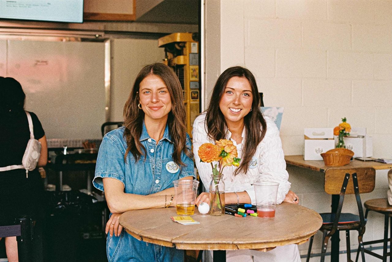 Two white women standing side by side