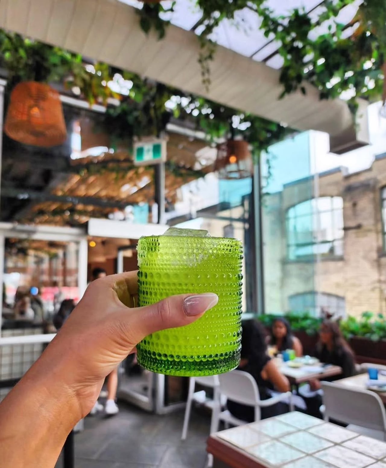 The rooftop patio at Baro and a cocktail