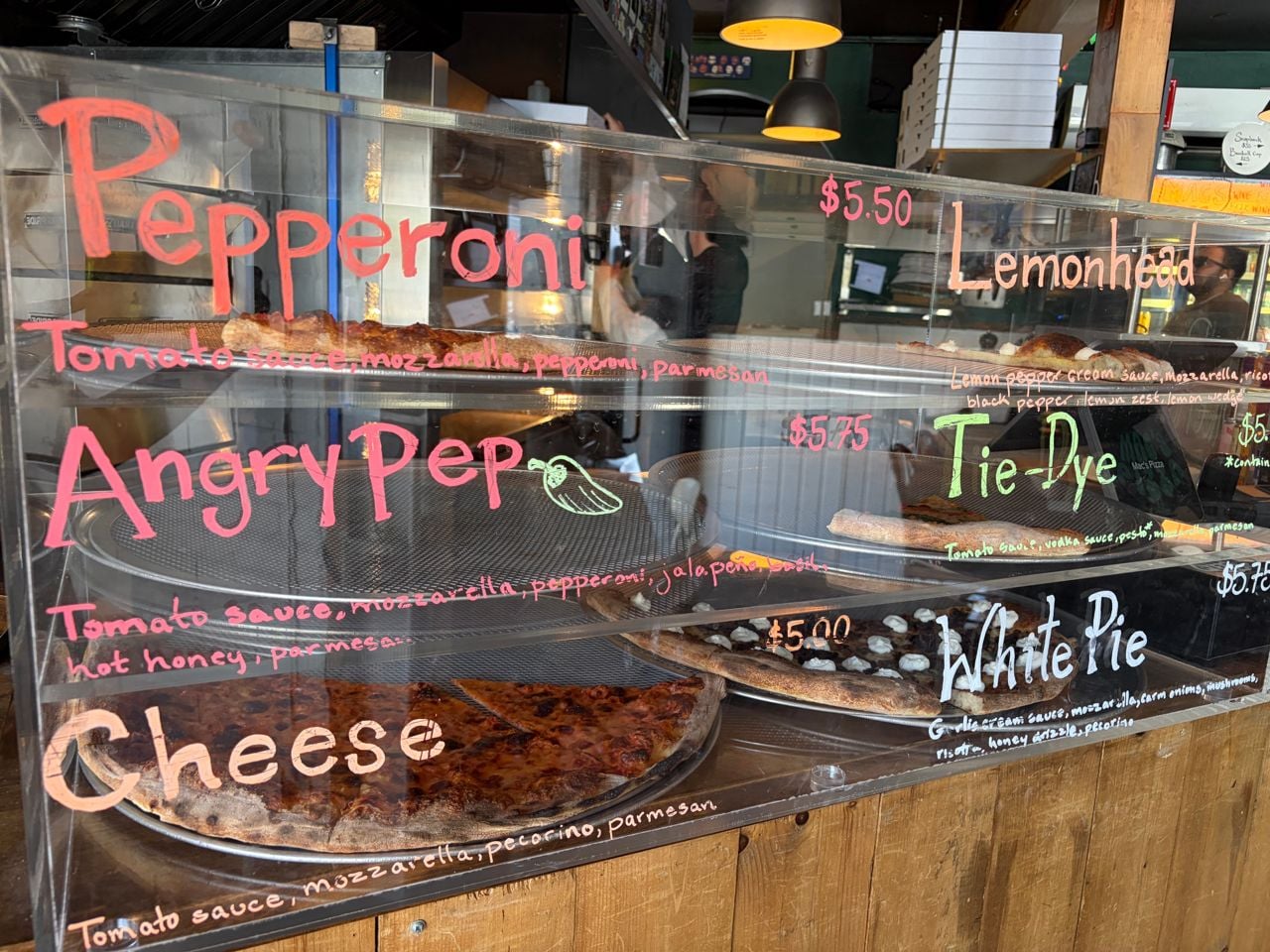 The pizza slice display case at Mac's Pizza