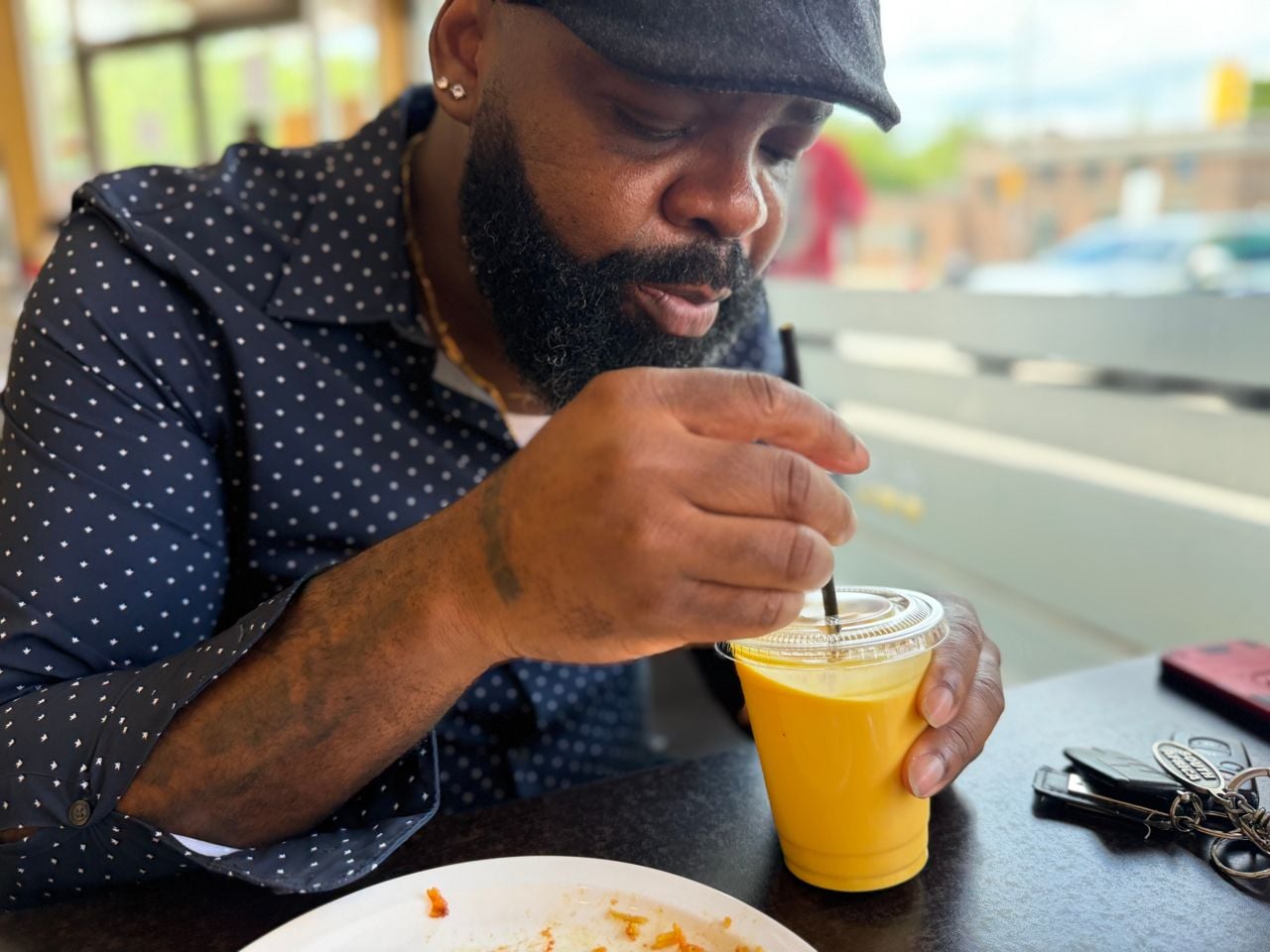 Chef James Obazee drinks a mango lassi