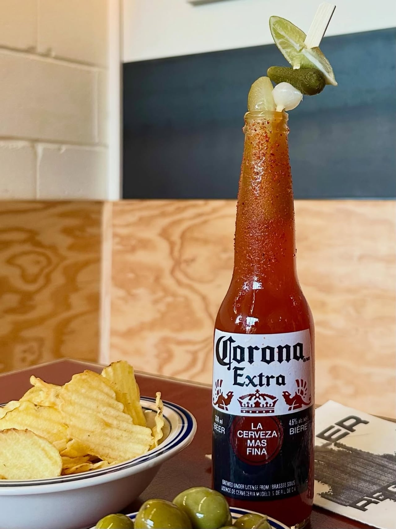 The Sun Burn drink and a bowl of chips and olives at Osler Records