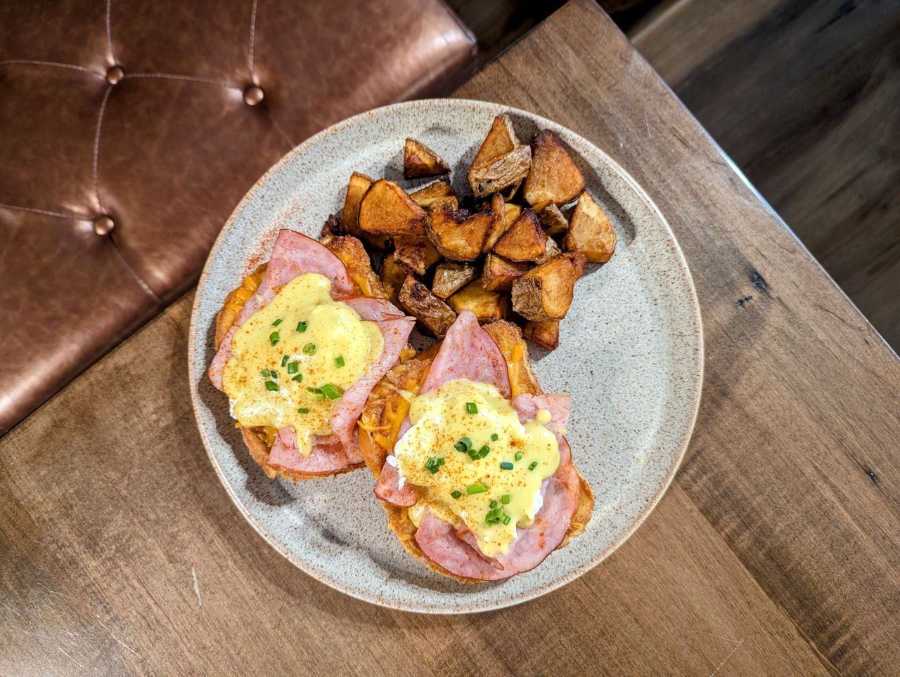 Eggs Benedict with ham and home fries