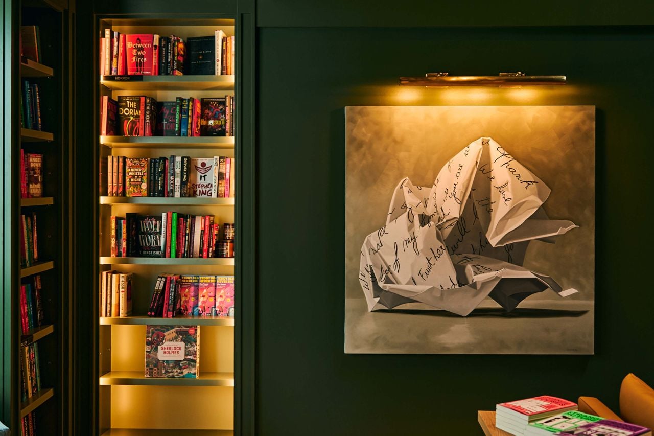 Art hangs on the wall in a bookstore