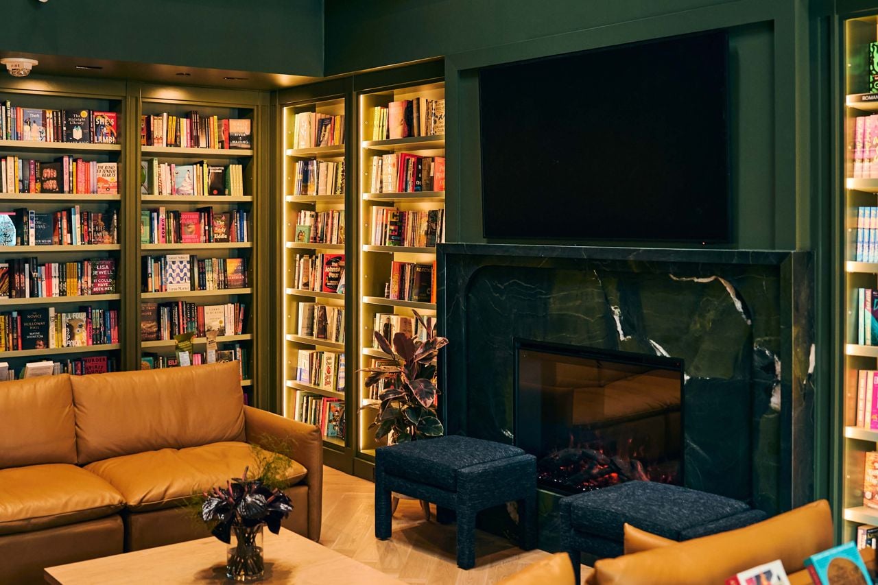 A fireplace with couches in front of it in a bookstore