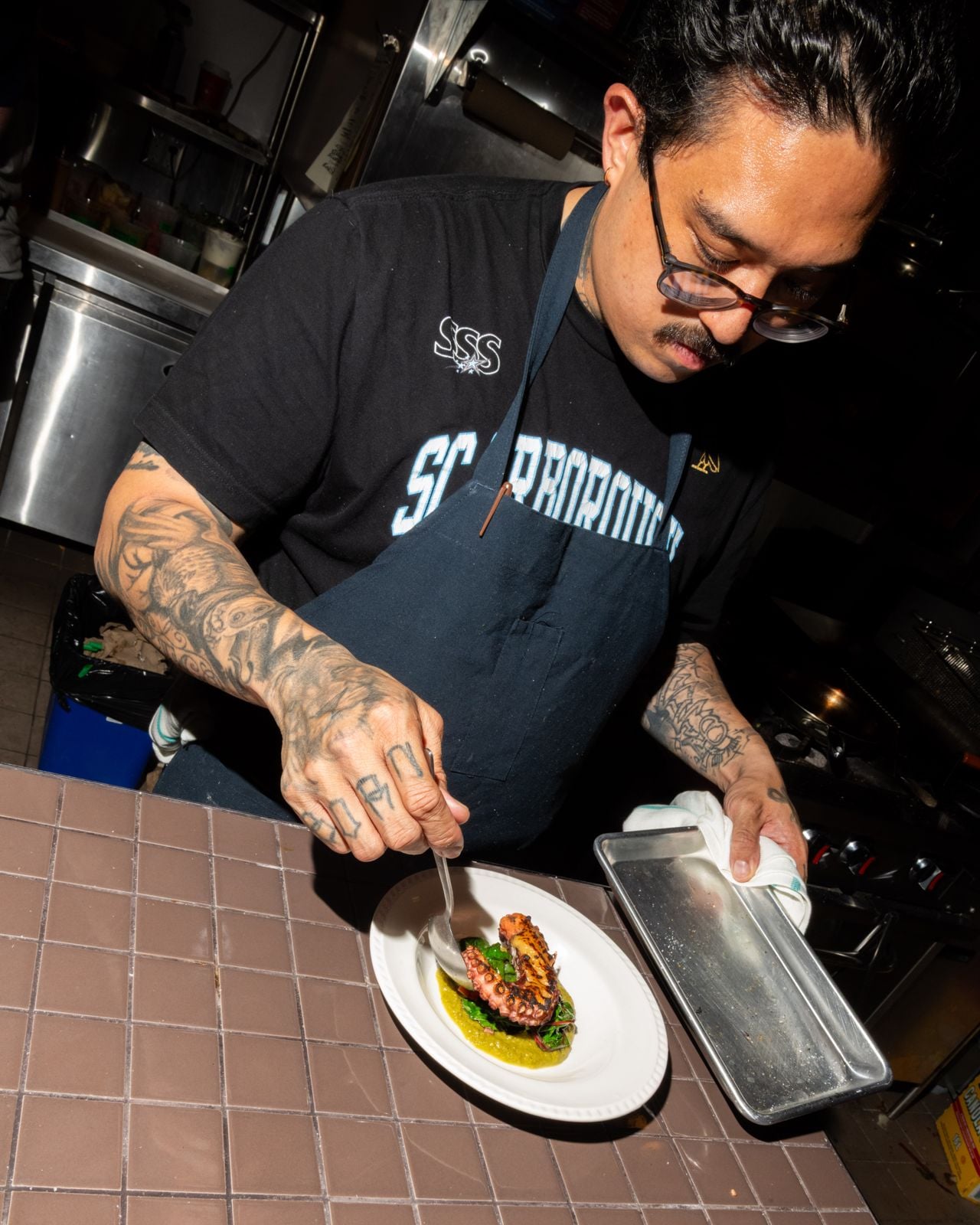 Chef Ken Envidia at the Gemini plates an octopus dish