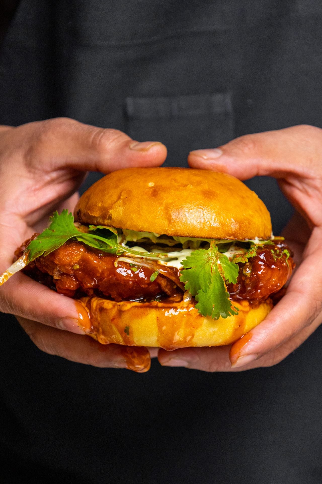A person holds a slider