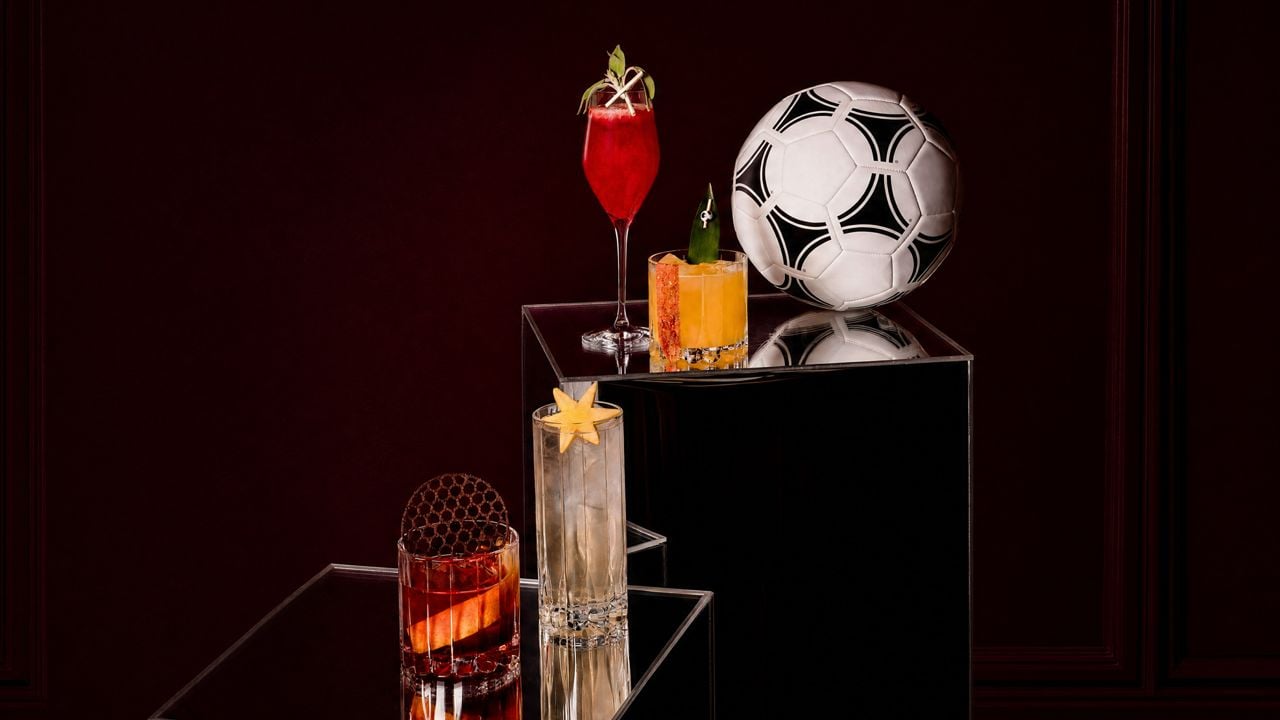 World Cup–inspired cocktails next to a soccer ball