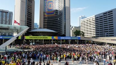 Toronto police arrested a soccer fan for holding up a "FIFA = Greed" sign