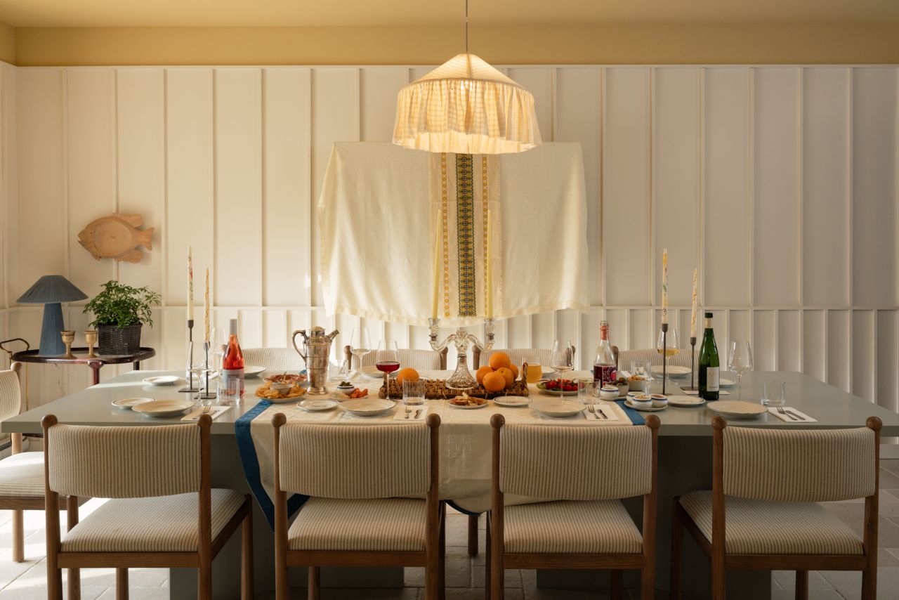 Dining table with chairs in an elegant white room