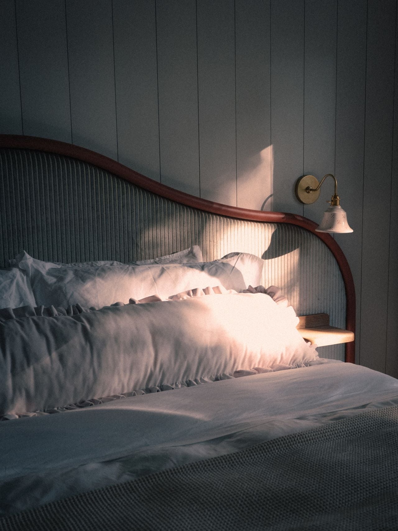 Morning light streaming into windows on pillows