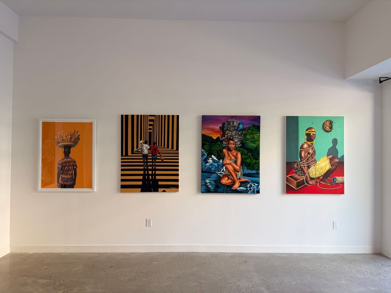 Four paintings on a wall