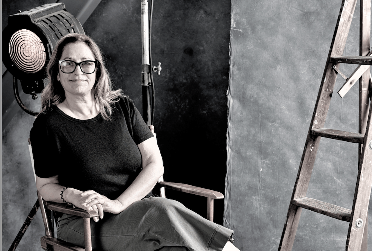 Woman sitting in a director's chair