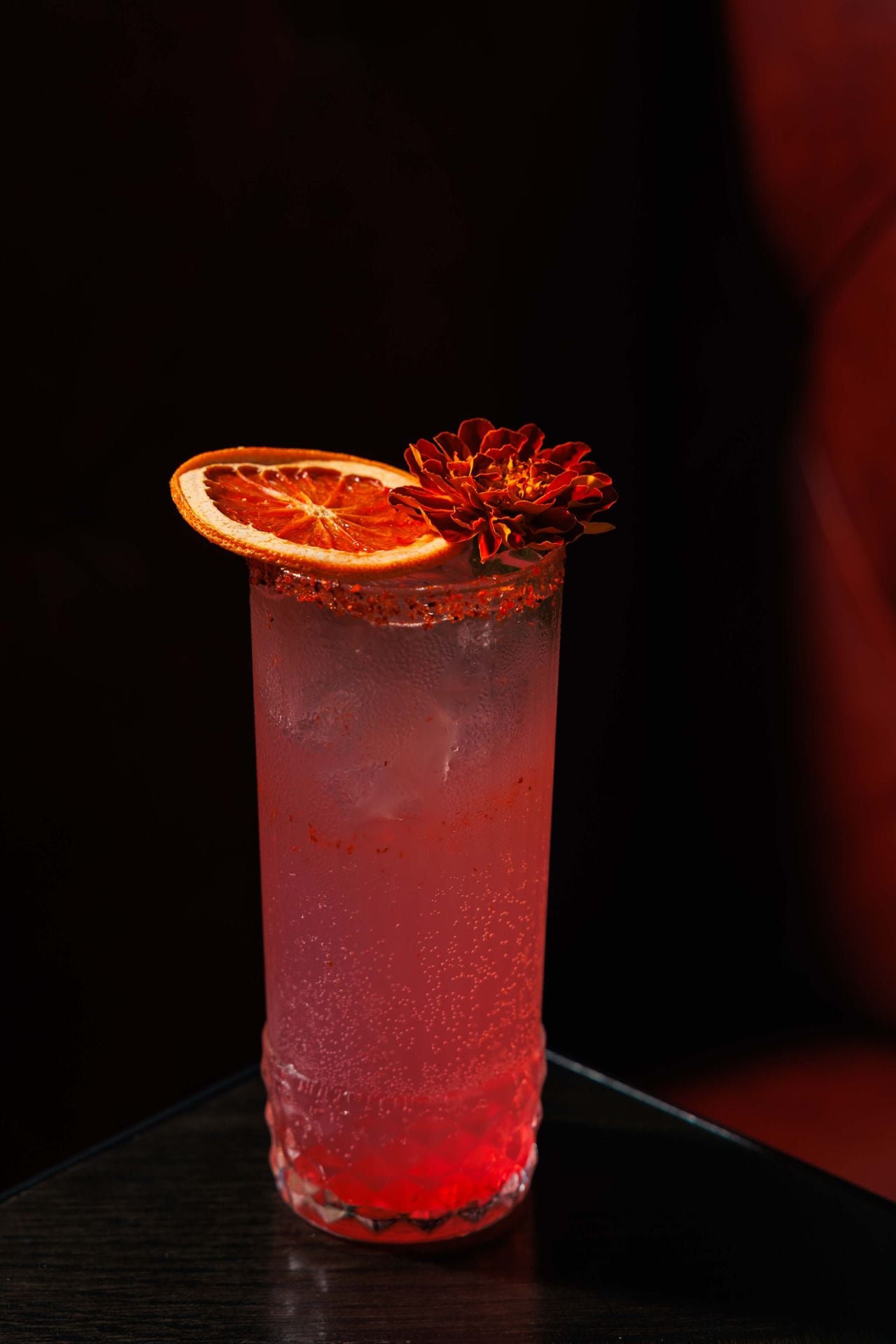 Jilly’s Palomita Rosa is a ruby-red take on a classic paloma made with El Tequileño Reposado, Ting grapefruit soda, lime, house-made hibiscus syrup and a Tajín rim
