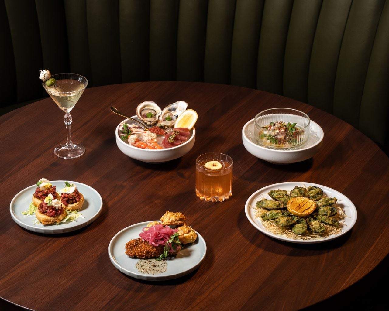 A spread of appetizers and cocktails at Bar Butcher