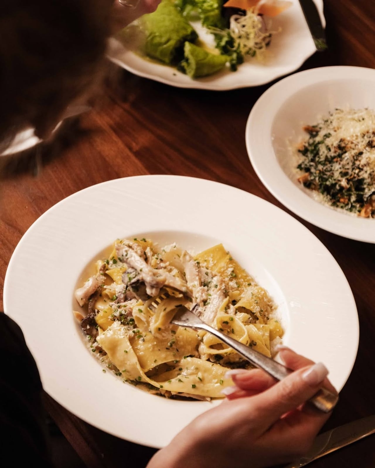 A spread of dishes at Cafe Boulud in Toronto