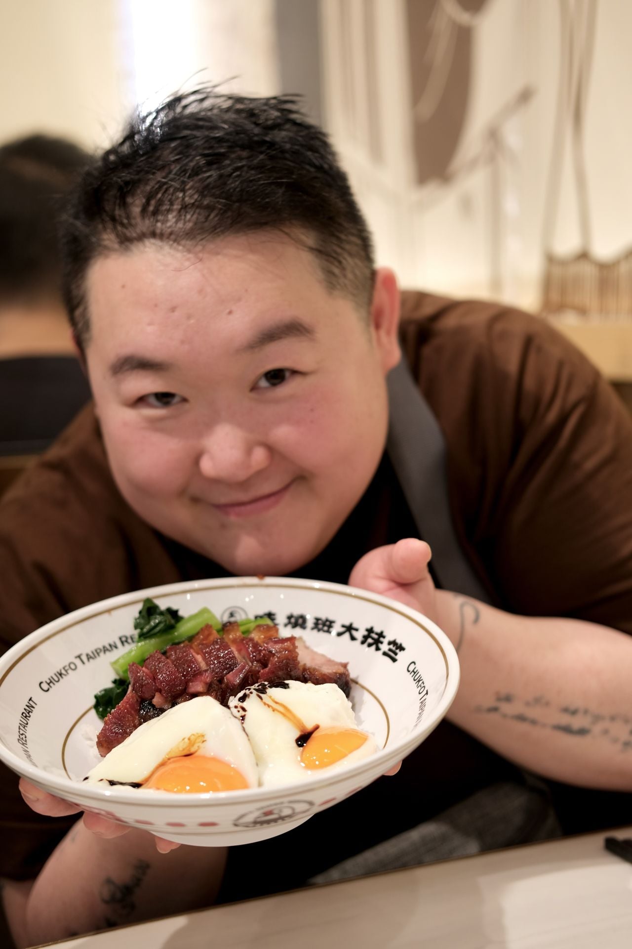 Chef Eva Chin with a bowl of char siu