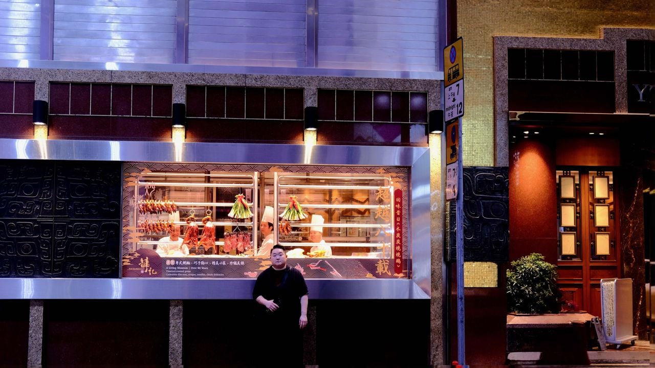 Chef Eva Chin stands outside of a restaurant in Hong Kong