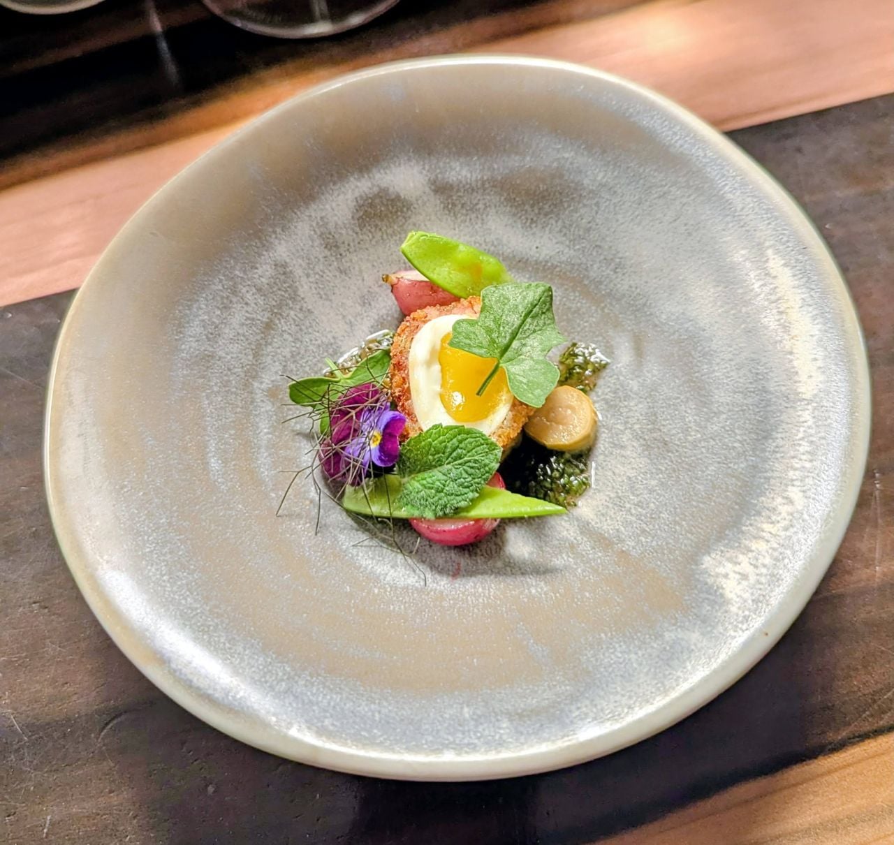 A Scotch egg with garden salat at Down Home Farmhouse Restaurant